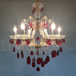 Lustre de vela dourada de 6 luzes com cristal vermelho